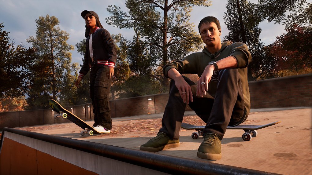 Tony Hawk sitzt auf Skateboard
