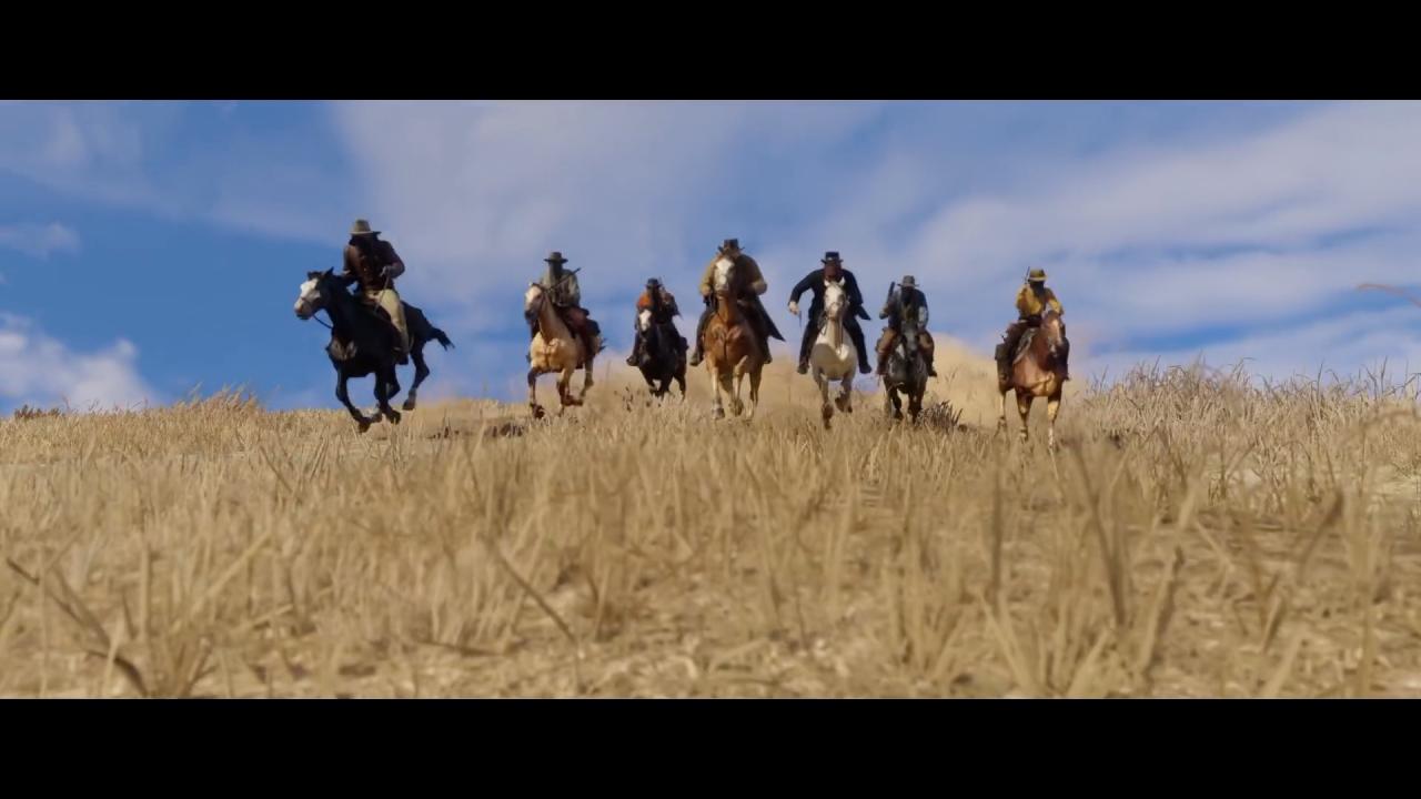 Sieben vermummte Männer reiten auf die Kamera zu.