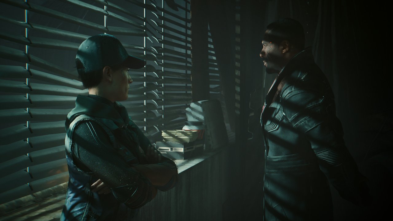Präsidentin Myers und Agent Solomon Reed stehen am Fenster eines unbeleuchteten Appartments.