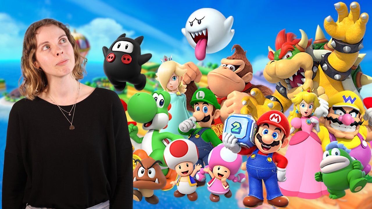 Die Autorin neben den Charakteren aus Mario Party