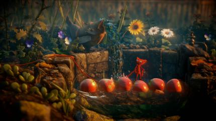 Da Yarny winzig ist, seht ihr die Spielwelt stets in großen Zoomstufen, sodass Objekte, wie hier die Äpfel, riesig wirken.