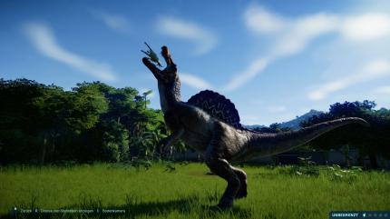 Ein Fleischfresser mampft eine Ziege im Spiel Jurassic World Evolution.