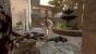 Nick, der zynische Anzugträger ist mit einer Axt unterwegs: Screenshot aus Left 4 Dead 2. 
