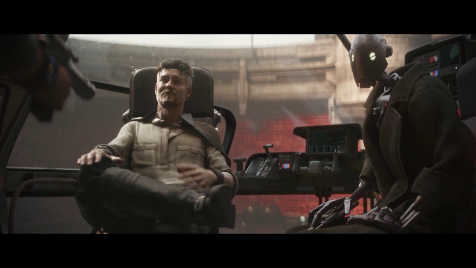 Ein Mann und ein Droide sitzen im Cockpit eines Raumschiffes.
