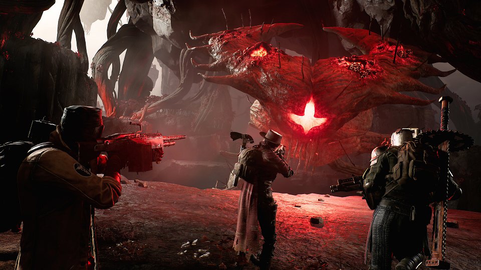 Drei Spieler nehmen einen Boss unter Beschuss.